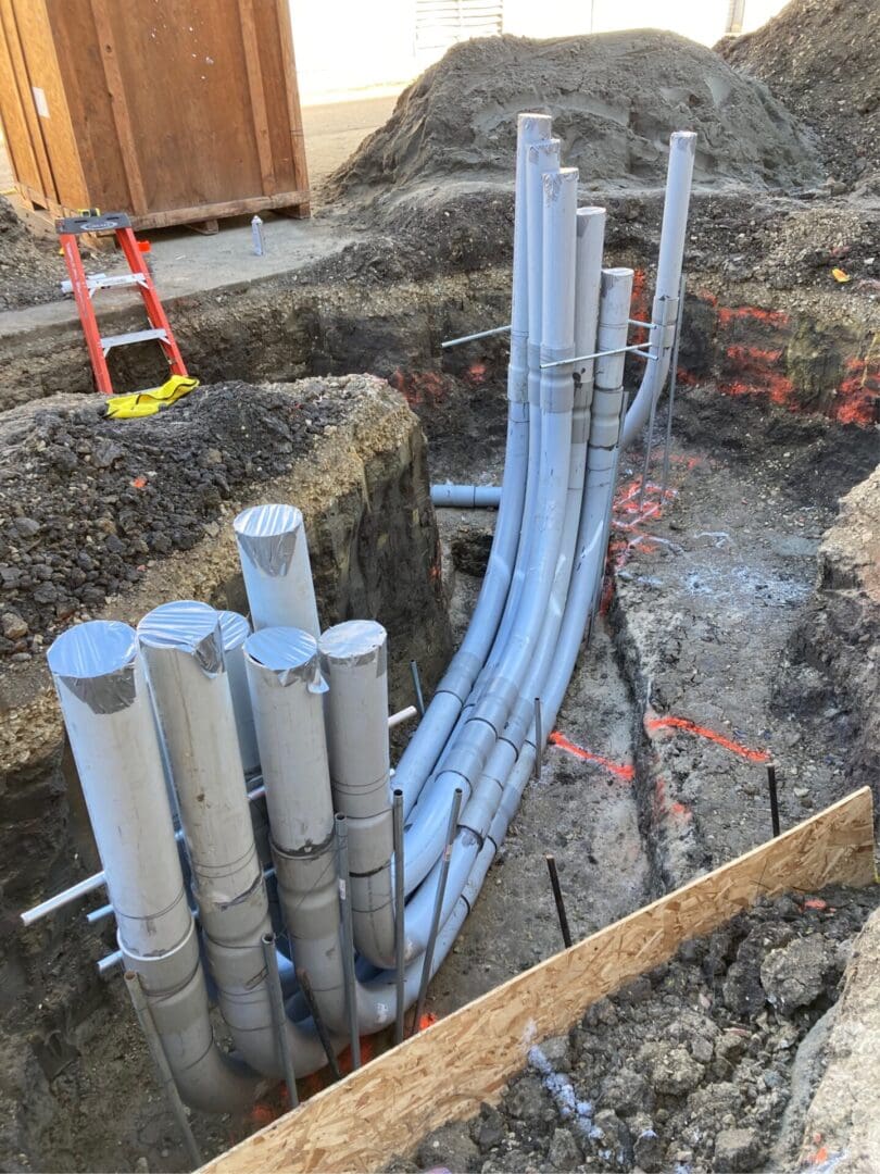 A construction site with pipes and concrete