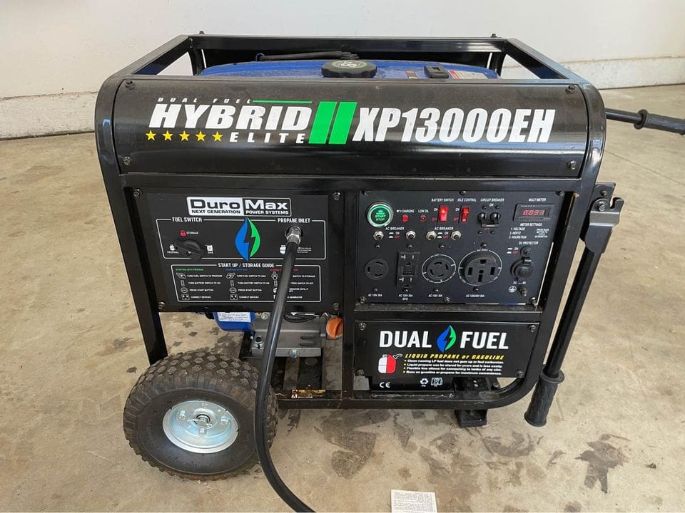 A generator with the words " hybrid xp 1 3 0 0 oen ".